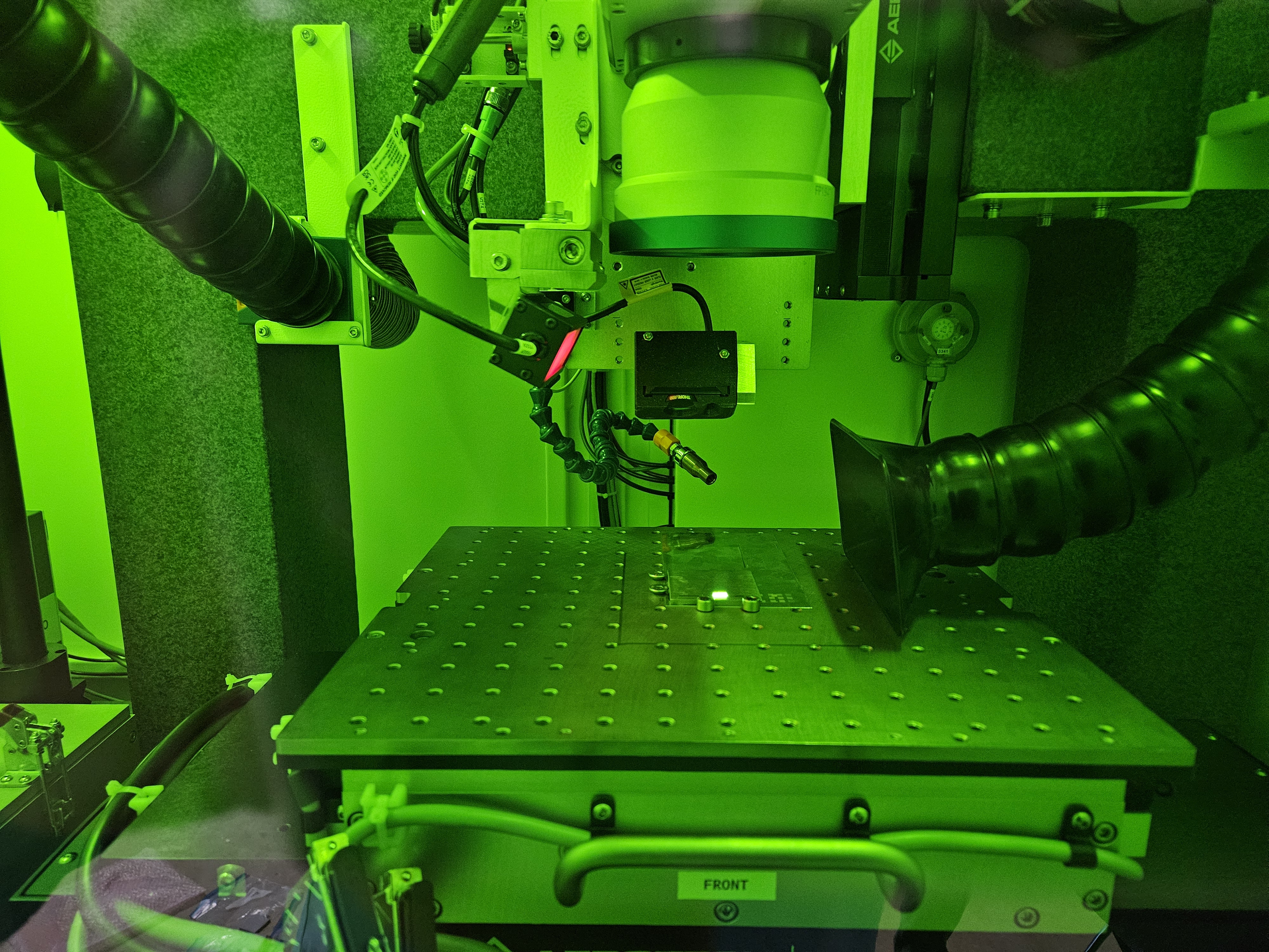 Submitted by CLT: Ultra Short Pulse Laser (USPL) Workstation processing sample material.